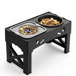 A black elevated double pet feeder with two bowls, one filled with dry dog food and the other with bone-shaped treats, shown on a clean white background.