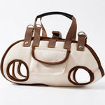 Black and brown PAWZINA cat carrier handbags shown together