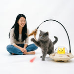 Close-up of the replaceable feather attachment on cat teaser toy