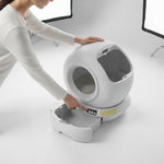 Detachable components shown for cleaning the automatic litter box