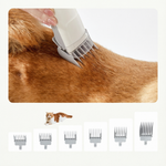 Dog grooming vacuum shown with clipper and attached suction hose