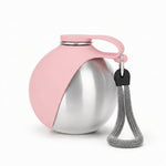 Portable dog bottle shown beside its secure sealing lid