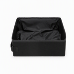 Collapsible cat litter box shown folded for compact storage