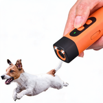 Compact handheld dog bark control device shown in one hand